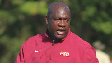 Florida State Seminoles running backs coach David Johnson shouts instructions during practice.