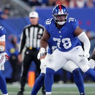 Oct 9, 2025; East Rutherford, New Jersey, USA; New York Giants offensive tackle Andrew Thomas (78) blocks against Philadelphia Eagles linebacker Jalyx Hunt (58) during the first quarter at MetLife Stadium.