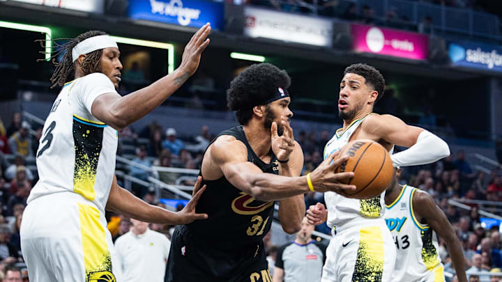 Apr 10, 2025; Indianapolis, Indiana, USA; Cleveland Cavaliers center Jarrett Allen (31) passes the ball while Indiana Pacers guard Tyrese Haliburton (0) defends in the first half at Gainbridge Fieldhouse. Mandatory Credit: Trevor Ruszkowski-Imagn Images Apr 10, 2025; Indianapolis, Indiana, USA; Cleveland Cavaliers center Jarrett Allen (31) passes the ball while Indiana Pacers guard Tyrese Haliburton (0) defends in the first half at Gainbridge Fieldhouse. Mandatory Credit: Trevor Ruszkowski-Imagn Images
