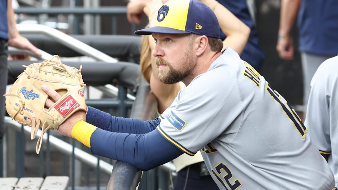 Jul 2, 2025; New York City, New York, USA;  Milwaukee Brewers first baseman Rhys Hoskins (12) watches from the dugout prior to game against the New York Mets at Citi Field. Mandatory Credit: Wendell Cruz-Imagn Images