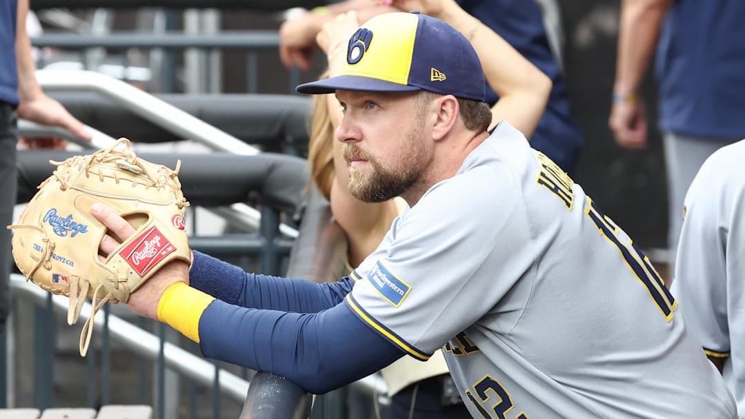 Jul 2, 2025; New York City, New York, USA;  Milwaukee Brewers first baseman Rhys Hoskins (12) watches from the dugout prior to game against the New York Mets at Citi Field.
