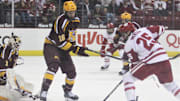 Wisconsin's Dominick Mersch (25) can't get a shot past Minnesota's Colin Schmidt (16) and Justen Close (1) during the teams' hockey game at the Kohl Center in Madison, Wis. on Friday Feb. 10, 2023. Minnesota won, 4-1.

Uwice Minnesota 1 Feb 9 2023