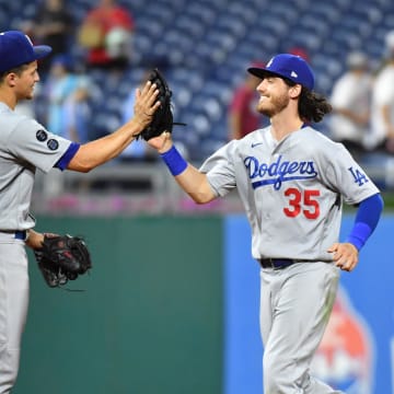 Aug 10, 2021; Philadelphia, Pennsylvania, USA; Los Angeles Dodgers shortstop Corey Seager (5) and center fielder Cody Bellinger (35) celebrate after defeating the Philadelphia Phillies at Citizens Bank Park. Mandatory Credit: Eric Hartline-USA TODAY Sports