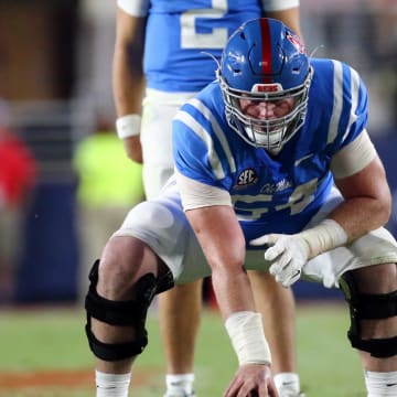 Sep 30, 2023; Oxford, Mississippi, USA; Mississippi Rebels offensive linemen Caleb Warren (54) waits to snap the ball during the second half against the LSU Tigers at Vaught-Hemingway Stadium. Mandatory Credit: Petre Thomas-USA TODAY Sports