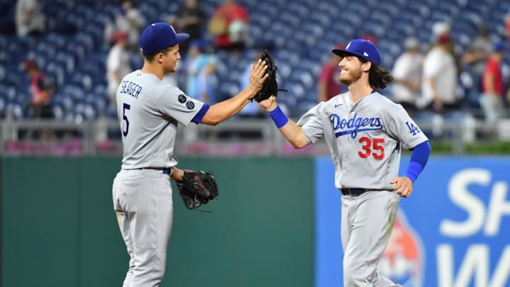 Aug 10, 2021; Philadelphia, Pennsylvania, USA; Los Angeles Dodgers shortstop Corey Seager (5) and center fielder Cody Bellinger (35) celebrate after defeating the Philadelphia Phillies at Citizens Bank Park. Mandatory Credit: Eric Hartline-USA TODAY Sports