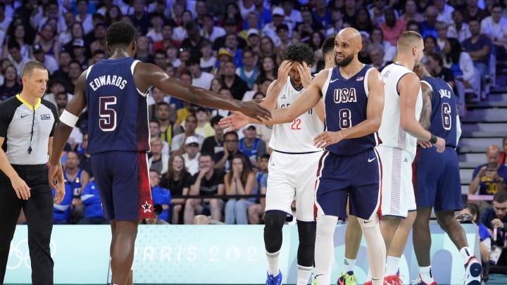 Jul 28, 2024; Villeneuve-d'Ascq, France; United States guard Derrick White (8) and guard Anthony Edwards (5) celebrate after a play in the second quarter against Serbia during the Paris 2024 Olympic Summer Games at Stade Pierre-Mauroy. 