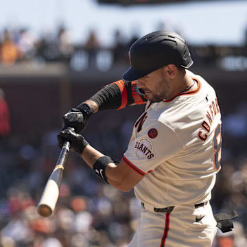 Sep 5, 2024; San Francisco, California, USA;  San Francisco Giants outfielder Michael Conforto (8) hits a double during the sixth inning against the Arizona Diamondbacks at Oracle Park.