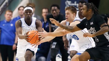 Mawot Mag takes the baton from Dallin Hall against Cincinnati