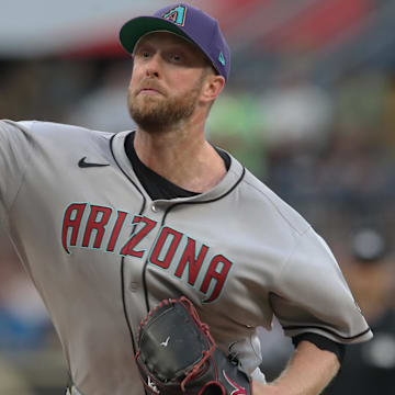 Jul 26, 2025; Pittsburgh, Pennsylvania, USA;  Arizona Diamondbacks starting pitcher Merrill Kelly (29) delivers a pitch against the Pittsburgh Pirates during the first inning at PNC Park. 