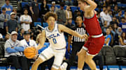 Nov 3, 2025; Los Angeles, California, USA;  UCLA Bruins guard Trent Perry (0) dribbles the ball against Eastern Washington Eagles forward Emmett Marquardt (33) during the second half at Pauley Pavilion presented by Wescom Financial. Mandatory Credit: Kiyoshi Mio-Imagn Images