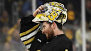 May 12, 2024; Boston, Massachusetts, USA; Boston Bruins goaltender Jeremy Swayman (1) slips on his mask during the second period in game four of the second round of the 2024 Stanley Cup Playoffs against the Florida Panthers at TD Garden. Mandatory Credit: Bob DeChiara-Imagn Images