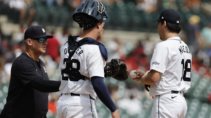 Aug 15, 2024; Detroit, Michigan, USA;  Detroit Tigers manager A.J. Hinch (14) takes the ball to relieve pitcher Kenta Maeda (18) in the seventh inning against the Seattle Mariners at Comerica Park.