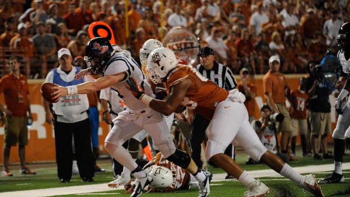 Sep 14, 2013; Austin, TX, USA; Mississippi Rebels quarterback Bo Wallace (14) runs for a touchdown against the Texas Longhorns during the second half at Darrell K Royal-Texas Memorial Stadium. Ole Miss beat Texas 44-23. Mandatory Credit: Brendan Maloney-USA TODAY Sports