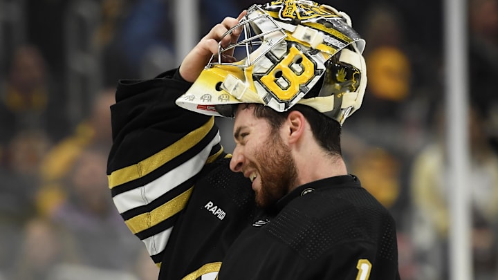 May 12, 2024; Boston, Massachusetts, USA; Boston Bruins goaltender Jeremy Swayman (1) slips on his mask during the second period in game four of the second round of the 2024 Stanley Cup Playoffs against the Florida Panthers at TD Garden. Mandatory Credit: Bob DeChiara-Imagn Images