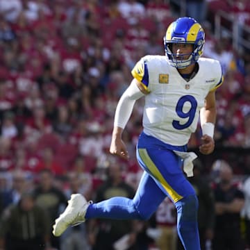 Nov 9, 2025; Santa Clara, California, USA; Los Angeles Rams running back Kyren Williams (23) runs for a touchdown as Los Angeles Rams quarterback Matthew Stafford (9) watches during the first quarter against the San Francisco 49ers at Levi's Stadium. Mandatory Credit: Kyle Terada-Imagn Images