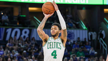 Nov 9, 2025; Orlando, Florida, USA; Boston Celtics guard Anfernee Simons (4) shoots a three point basket during the second quarter against the Orlando Magic at Kia Center. Mandatory Credit: Mike Watters-Imagn Images