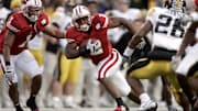 November 12, 2005; Madison, WI, USA; Wisconsin Badgers running back Brian Calhoun (2) carries the ball after catching a pass as Iowa Hawkeyes defensive back #26 Jovon Johnson looks on during the second quarter at Camp Randall Stadium. 
