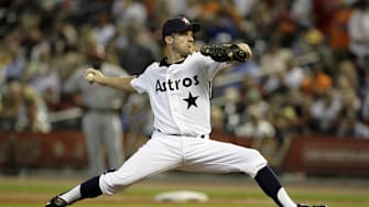 July 24, 2010; Houston, TX, USA; Houston Astros starting pitcher Roy Oswalt (44) throws a pitch against the Cincinnati Reds in the first inning at Minute Maid Park. The Reds defeated the Astros 7-0. 