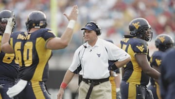 Jan 01, 2005; Jacksonville, FL, USA;  West Virginia Mountaineers headcoach Rich Rodriguez walks the sidelines after West Virginia was successful on a third quarter field goal attempt in the 2005 Toyota Gator Bowl held at Alltel Stadium. Mandatory Credit: Photo by Imagn Images (©) Copyright 2004 by Preston Mack