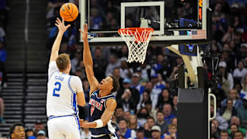 Mar 27, 2025; Newark, NJ, USA; Duke Blue Devils forward Cooper Flagg (2) shoots the ball against Arizona Wildcats forward Carter Bryant (9) during the first half during an East Regional semifinal of the 2025 NCAA tournament at Prudential Center. Mandatory Credit: Robert Deutsch-Imagn Images