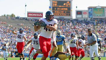 September 20, 2008; Pasadena, CA, USA; Arizona Wildcats tight end Rob Gronkowski (48) runs in to score a touchdown against the UCLA Bruins in the second half at the Rose Bowl. Arizona defeated UCLA 31-10. Mandatory Credit: Gary A. Vasquez-Imagn Images