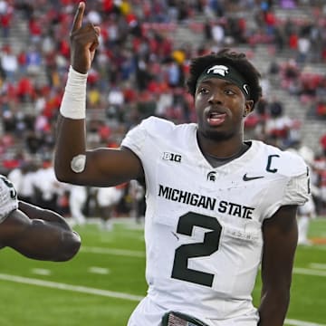 Sep 7, 2024; College Park, Maryland, USA; Michigan State Spartans quarterback Aidan Chiles (2) and  running back Nate Carter (5) celebrate on the sidelines during the second half  against the Maryland Terrapins at SECU Stadium. Mandatory Credit: Tommy Gilligan-Imagn Images