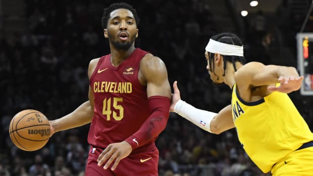 Apr 12, 2024; Cleveland, Ohio, USA; Cleveland Cavaliers guard Donovan Mitchell (45) dribbles beside