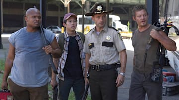 Andrew Lincoln, Norman Reedus, Steven Yeun, and IronE Singleton in The Walking Dead season 1