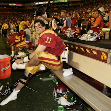 Jan 04, 2005; Miami, FL, USA; USC Trojans quarterback Matt Leinart sits on the bench during the fourth quarter of USC's 55-12 win in the 2005 Orange Bowl over the Oklahoma Sooners. Leinart, who threw 5 touchdowns, was named the game's MVP.
Mandatory Credit: Photo by Imagn Images (©) Copyright 2005 by Preston Mack