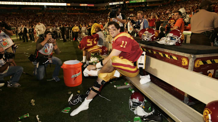 Jan 04, 2005; Miami, FL, USA; USC Trojans quarterback Matt Leinart sits on the bench during the fourth quarter of USC's 55-12 win in the 2005 Orange Bowl over the Oklahoma Sooners. Leinart, who threw 5 touchdowns, was named the game's MVP.
Mandatory Credit: Photo by Imagn Images (©) Copyright 2005 by Preston Mack