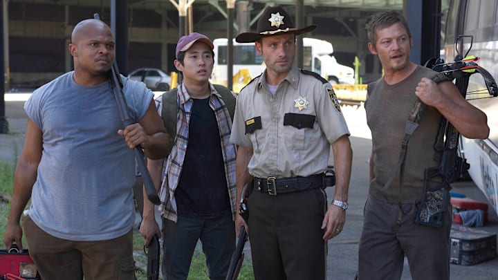 Andrew Lincoln, Norman Reedus, Steven Yeun, and IronE Singleton in The Walking Dead season 1