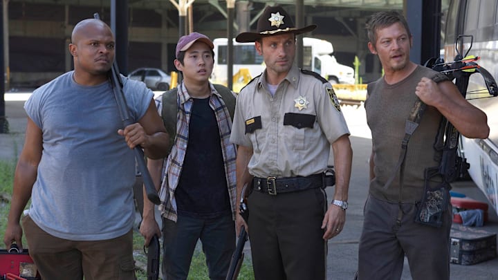 Andrew Lincoln, Norman Reedus, Steven Yeun, and IronE Singleton in The Walking Dead season 2