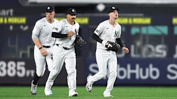 New York Yankees outfielders Cody Bellinger, Aaron Judge, and Trent Grisham.