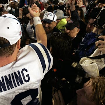 Feb 4, 2007; Miami, FL, USA;  Indianapolis Colts quarterback Peyton Manning (18) celebrates with head coach Tony Dundy after the Indianapolis Colts defeated the Chicago Bears 29-17 in Super Bowl XLI at Dolphins Stadium.  Mandatory Credit: Jason Parkhurst-Imagn Images Copyright © 2007 Jason Parkhurst