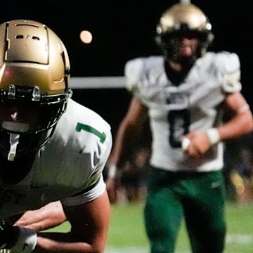 City High’s Coden Kurtz (18) tackles Iowa City West’s Ethan Headings (1) during a week 1 Iowa high school football game Aug. 29, 2025 at Iowa City City High in Iowa City, Iowa.
