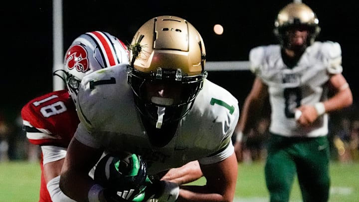 City High’s Coden Kurtz (18) tackles Iowa City West’s Ethan Headings (1) during a week 1 Iowa high school football game Aug. 29, 2025 at Iowa City City High in Iowa City, Iowa.