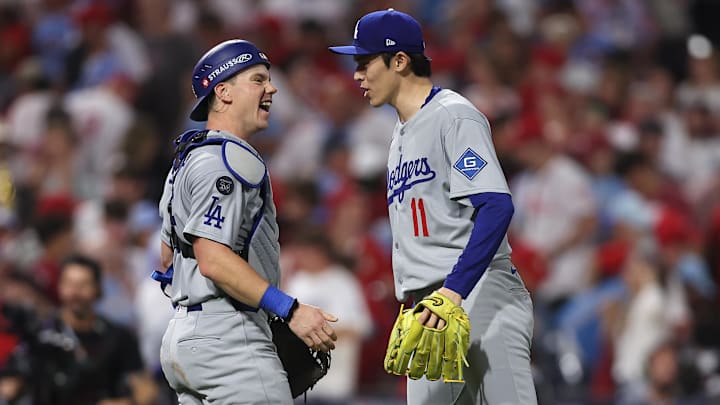 Oct 4, 2025; Philadelphia, Pennsylvania, USA; Los Angeles Dodgers pitcher Roki Sasaki (11) and catcher Will Smith (16) celebrate after defeating the Philadelphia Phillies in game one of the NLDS round for the 2025 MLB playoffs at Citizens Bank Park. Mandatory Credit: Bill Streicher-Imagn Images Oct 4, 2025; Philadelphia, Pennsylvania, USA; Los Angeles Dodgers pitcher Roki Sasaki (11) and catcher Will Smith (16) celebrate after defeating the Philadelphia Phillies in game one of the NLDS round for the 2025 MLB playoffs at Citizens Bank Park. Mandatory Credit: Bill Streicher-Imagn Images