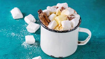 Hot chocolate with homemade marshmallow, chocolate chips, cinnamon sticks, and syrup