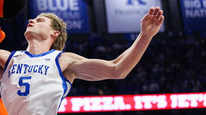 Mar 7, 2026; Lexington, Kentucky, USA; Florida Gators guard Boogie Fland (0) goes to the basket against Kentucky Wildcats forward Brandon Garrison (10) and guard Collin Chandler (5) during the first half at Rupp Arena at Central Bank Center. Mandatory Credit: Jordan Prather-Imagn Images