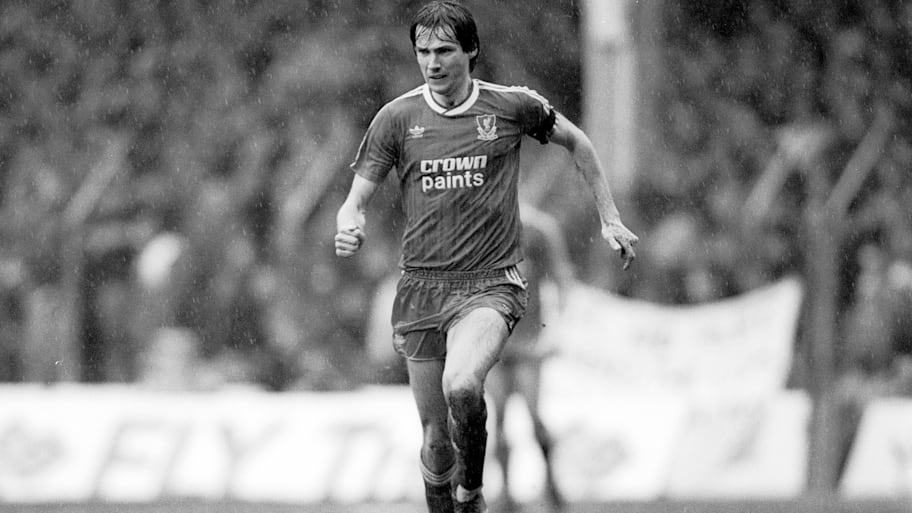 Alan Hansen striding forward in possession.