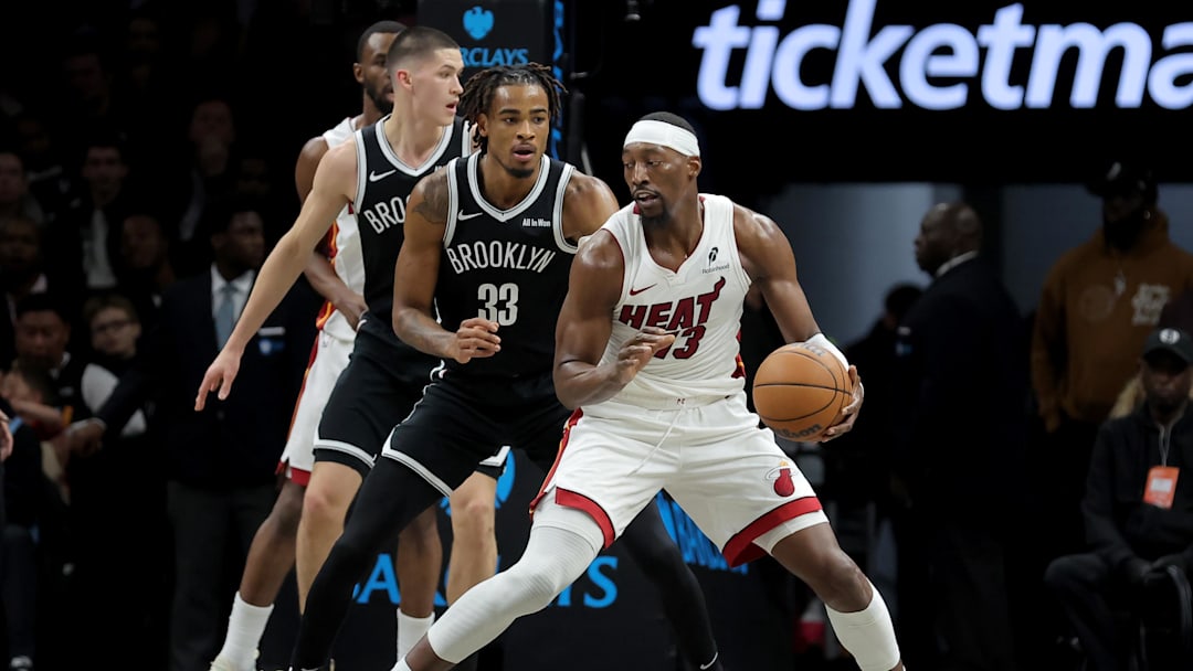 Dec 18, 2025; Brooklyn, New York, USA; Miami Heat center Bam Adebayo (13) controls the ball against Brooklyn Nets center Nic Claxton (33) during the first quarter at Barclays Center. Mandatory Credit: Brad Penner-Imagn Images Dec 18, 2025; Brooklyn, New York, USA; Miami Heat center Bam Adebayo (13) controls the ball against Brooklyn Nets center Nic Claxton (33) during the first quarter at Barclays Center. Mandatory Credit: Brad Penner-Imagn Images