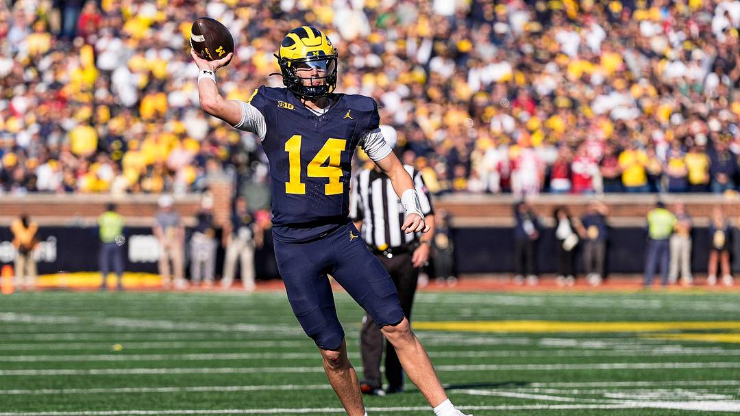 Michigan quarterback Tommy Carr (14) makes a pass against Indiana during the overtime at Michigan Stadium in Ann Arbor on Saturday, Oct. 24, 2026. Michigan quarterback Tommy Carr (14) makes a pass against Indiana during the overtime at Michigan Stadium in Ann Arbor on Saturday, Oct. 24, 2026.