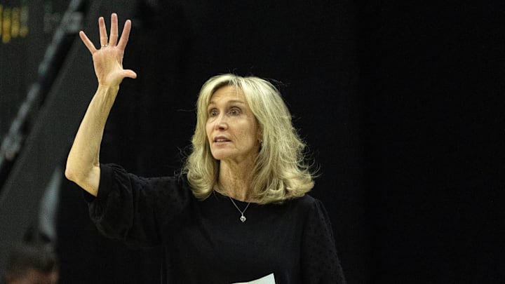 Washington coach Tina Langley calls a play against Oregon during the first half at Matthew Knight Arena Wednesday, Feb. 12, 2025.