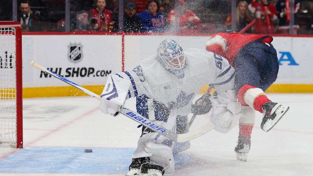 Feb 26, 2026; Sunrise, Florida, USA; Florida Panthers center Evan Rodrigues (17) scores against Toronto Maple Leafs goaltender Joseph Woll (60) during the first period at Amerant Bank Arena. Mandatory Credit: Sam Navarro-Imagn Images