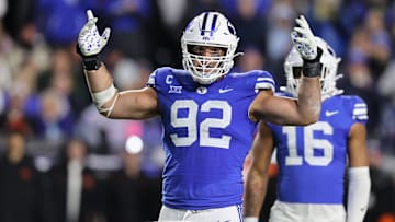 Oct 18, 2024; Provo, Utah, USA; Brigham Young Cougars defensive end Tyler Batty (92) encourages fans to cheer against the Oklahoma State Cowboys during the fourth quarter at LaVell Edwards Stadium. Mandatory Credit: Rob Gray-Imagn Images