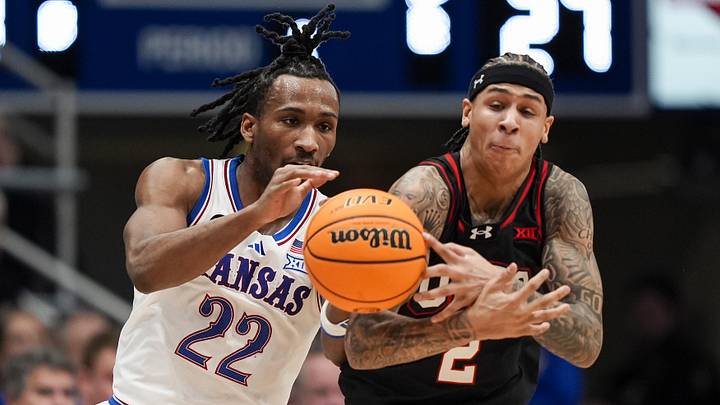 Feb 7, 2026; Lawrence, Kansas, USA; Utah Utes guard Terrence Brown (2) steals the ball from Kansas Jayhawks guard Darryn Peterson (22) during the first half at Allen Fieldhouse. 