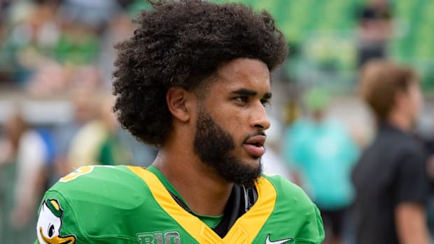 dante moore fernando mendoza oregon ducks indiana hoosiers dan lanning transfer portal quarterback nfl draft heisman big ten