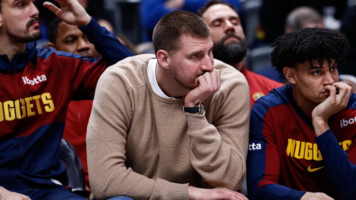 Denver Nuggets center Nikola Jokic sits on the bench. Denver Nuggets center Nikola Jokic sits on the bench.