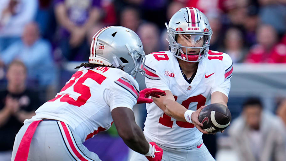 Ohio State quarterback Julian Sayin hands off to running back Bo Jackson.