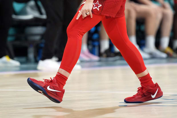 USA guard Sabrina Ionescu's red and white Nike sneakers.